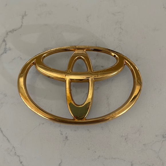 Genuine OEM Used Toyota Gold Emblem - Picture 1 of 5